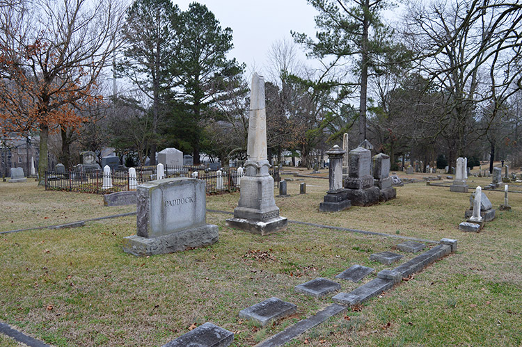 Family plots in cemetery with grave markers