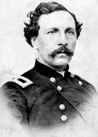 White man with mustache and wavy hair in military uniform