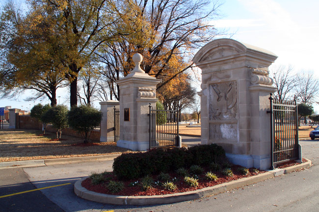 ornate stone pillars and iron gates