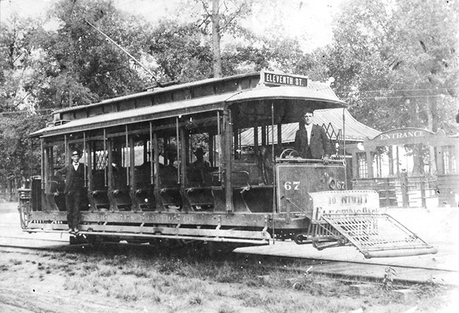 White men in uniform on trolley car at station