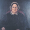 Painting of older white woman in black with black hair with brooch in red chair