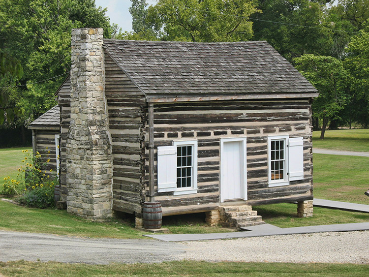 Log cabin with brick chimney