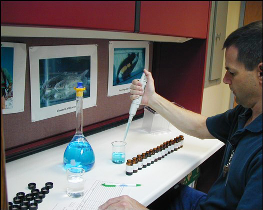 White man working in chemistry lab