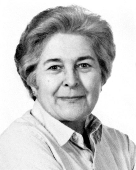 Older white woman with short gray hair and collared shirt