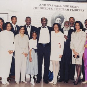 African-American family in museum gallery with exhibit panel