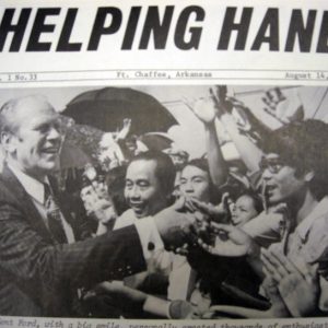 Cover of "Helping Hand" newspaper with picture of white man in suit and tie greeting crowd of Vietnamese refugees on it