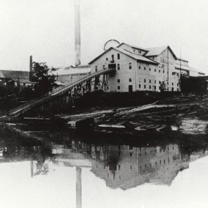 Multistory industrial buildings with river in the foreground