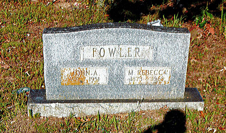 "John A. and M. Rebecca Fowler" gravestone in cemetery