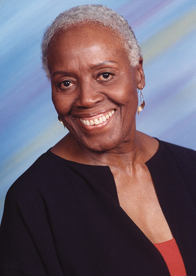 Older African-American woman smiling in dress