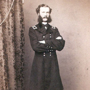 White man with long sideburns in military uniform