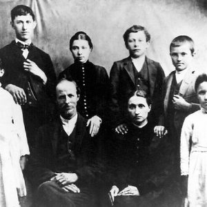 White man woman and children in family photograph
