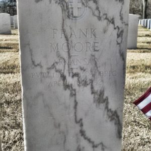 White marble gravestone with cross and "Frank Moore" engraving