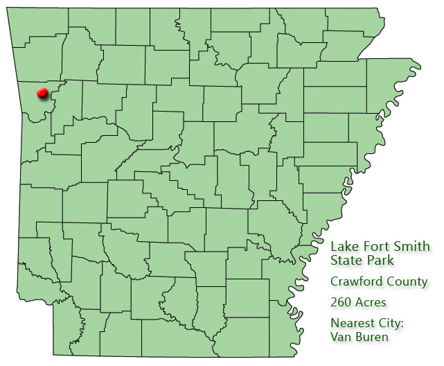 Arkansas map with red dot in Crawford County and explanation in green text