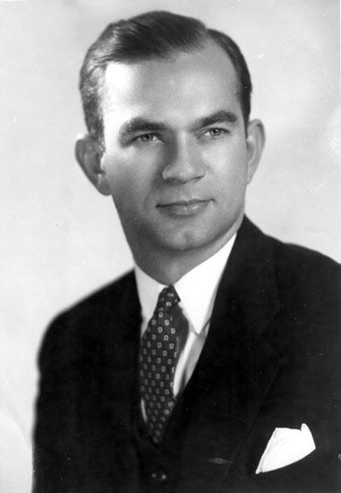 White man in suit with decorative tie