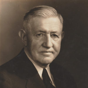 Old white man in suit and tie