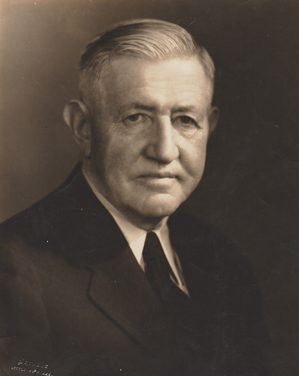 Old white man in suit and tie