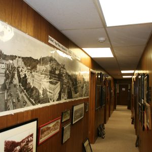 Hallway decorated with framed photographs and posters