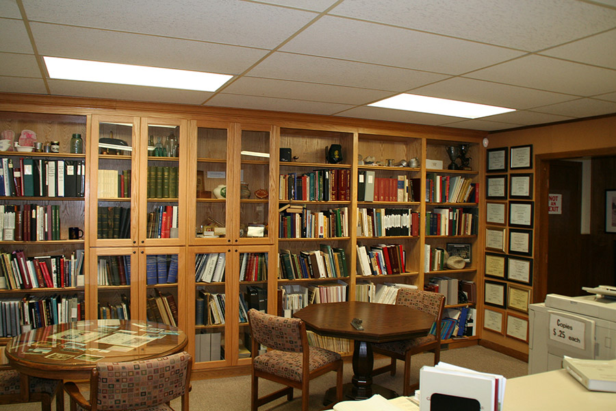 Research room with bookcases tables chairs and copy machine