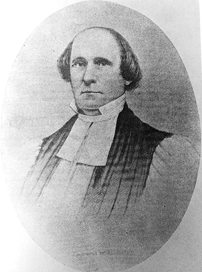 White man in robes and collar