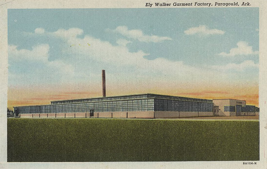 Postcard depicting long industrial building with smokestack