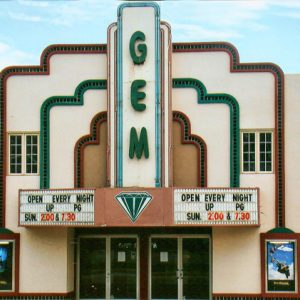 Multistory "Gem" theater building with marquee on street