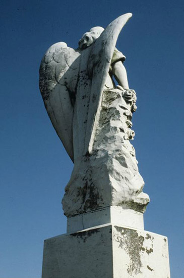 Rear view of angel statue on monument