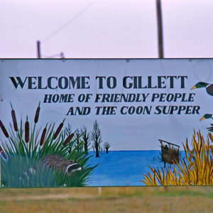 "Welcome to Gillett" sign with lake and ducks painted on it