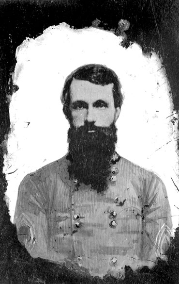White man with dark hair and long beard in military uniform