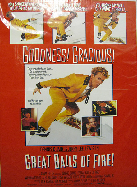 White man in yellow and black suit in various poses on red and white poster