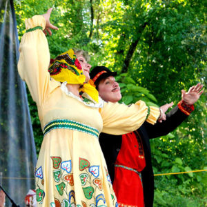 White dancers in eastern European costume performing on stage