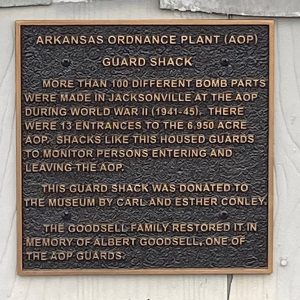 "Arkansas Ordnance Plant Guard Shack" plaque on wall