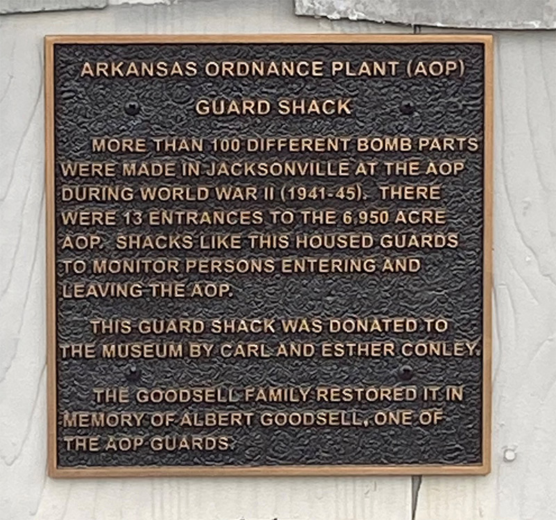 "Arkansas Ordnance Plant Guard Shack" plaque on wall