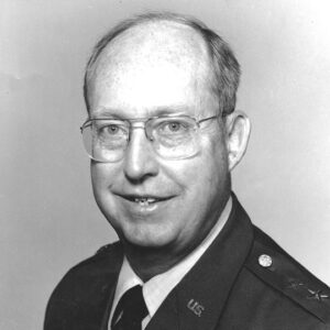 White man in military garb and glasses