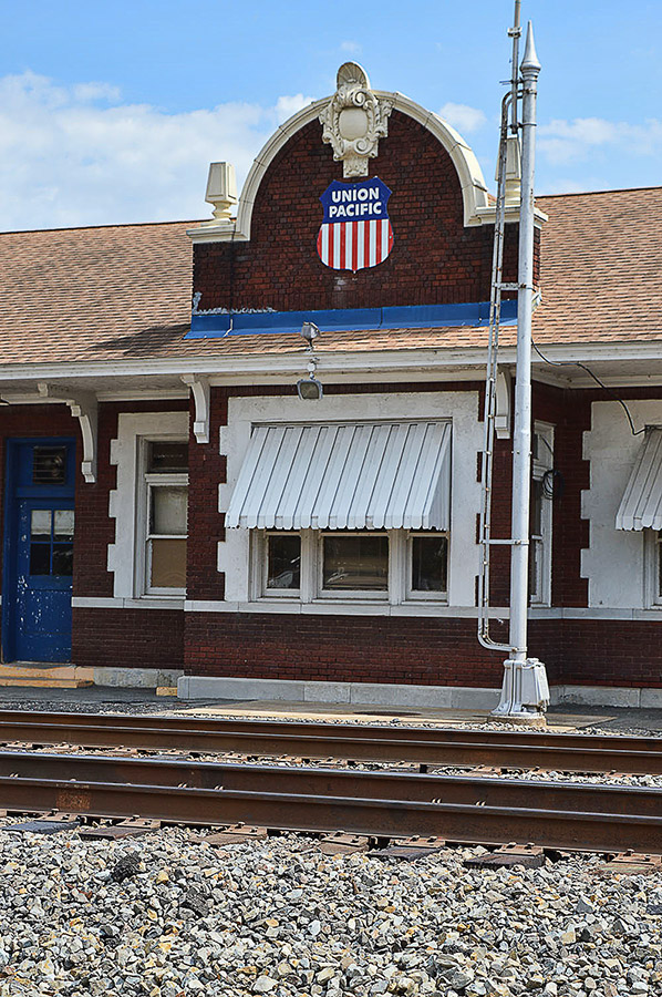 Close-up of brick train depot building with Union Pacific shield
