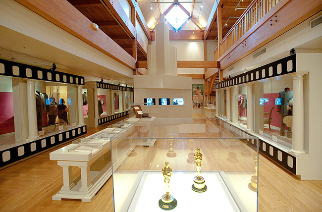 Interior of museum with awards and costumes in display cases