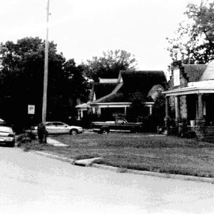 Houses with covered porches on residential street corner