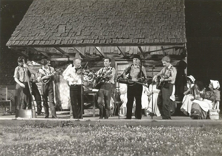 White musicians performing on outdoor stage