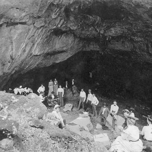 White men and women inside cave