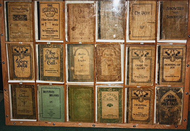 Rows of song books in glass display