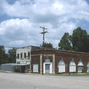 Brick storefronts on street corner with power lines