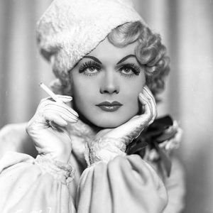 White man wearing ladies makeup with hat and cigarette