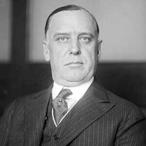 White man in striped suit and tie
