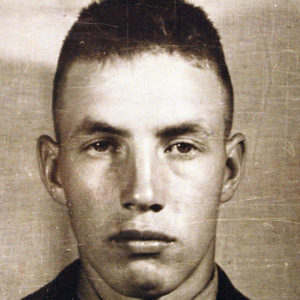 Young white man with short hair in military uniform