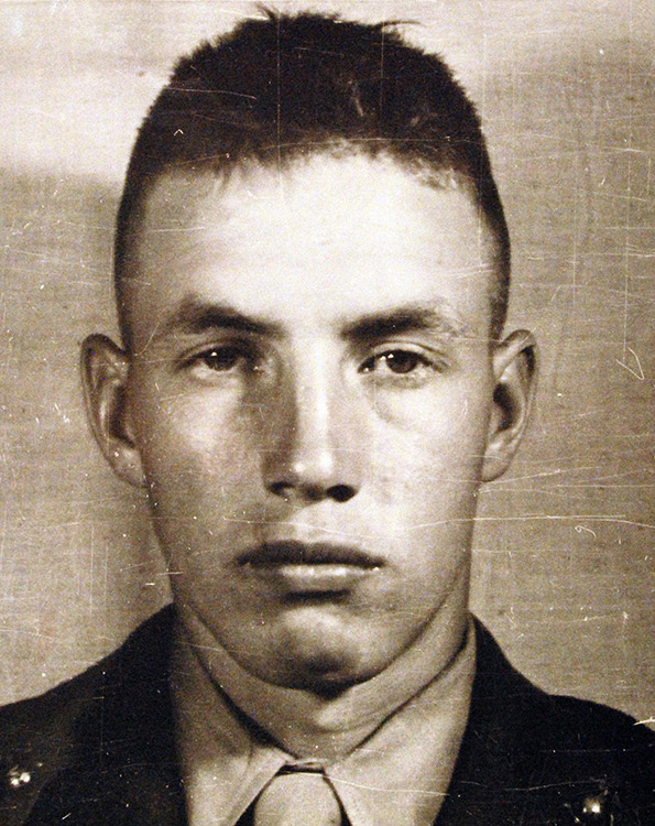 Young white man with short hair in military uniform