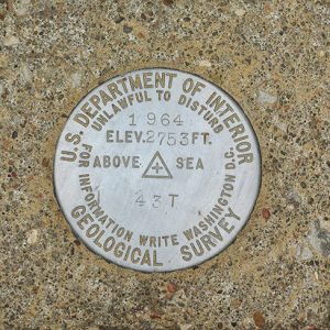 Round "U.S. Department of Interior Geological Survey" marker