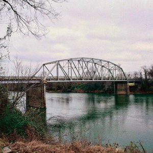 Steel arch truss bridge over river