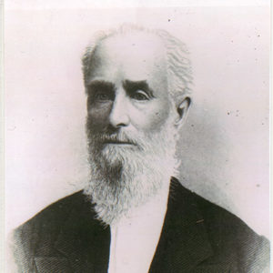 Old white man with long beard in suit and white shirt
