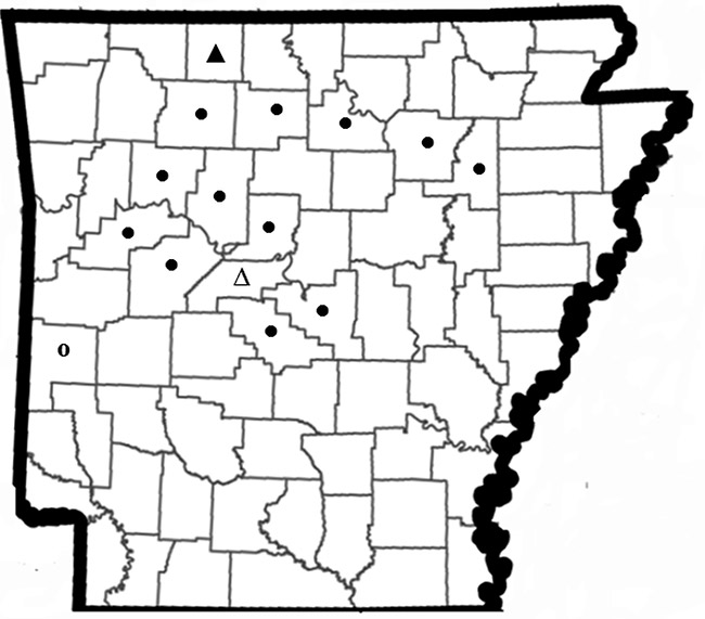 Map of Arkansas counties with black dots and triangles on it