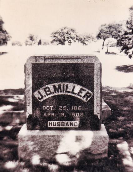 Square "J. B. Miller" gravestone in cemetery
