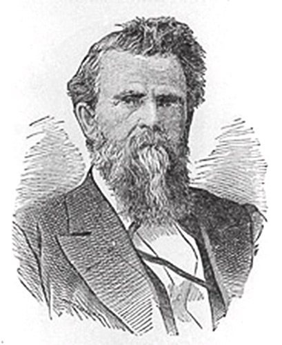 White man with long beard in suit and tie